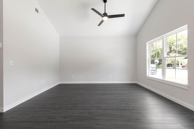 spare room with ceiling fan, dark hardwood / wood-style flooring, and vaulted ceiling