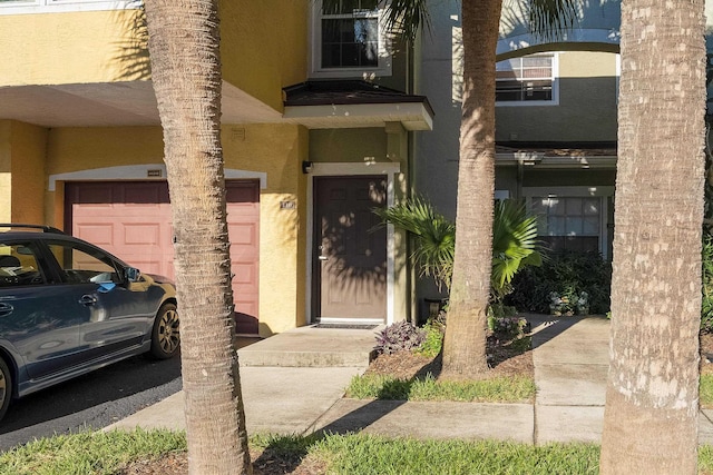 property entrance with a garage