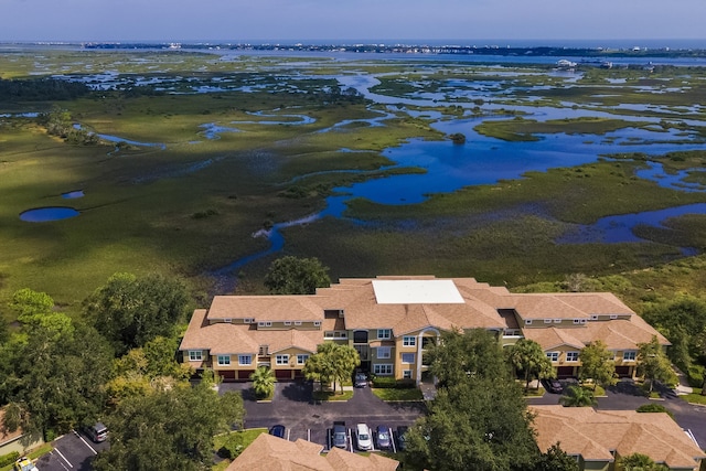 birds eye view of property featuring a water view