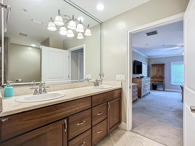 bathroom with vanity, tile patterned floors, ceiling fan, and ornamental molding