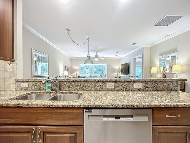 kitchen featuring ceiling fan, sink, light stone counters, stainless steel dishwasher, and ornamental molding