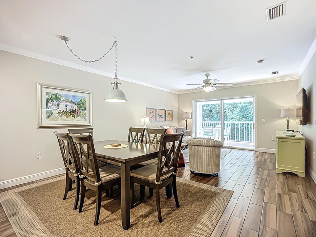 dining room with ceiling fan and ornamental molding