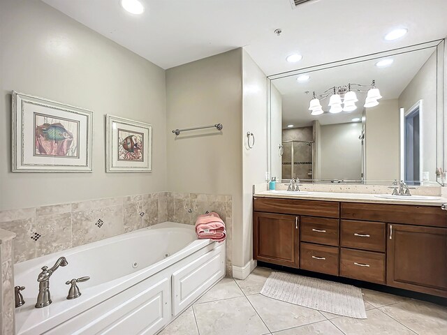 bathroom featuring tile patterned floors, vanity, and shower with separate bathtub