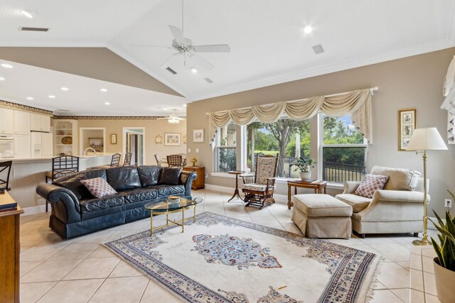 613 Wild Bird Ln, Saint Augustine, FL 32080 - living area featuring a ceiling fan, light tile patterned floors, crown molding, lofted ceiling, and recessed lighting