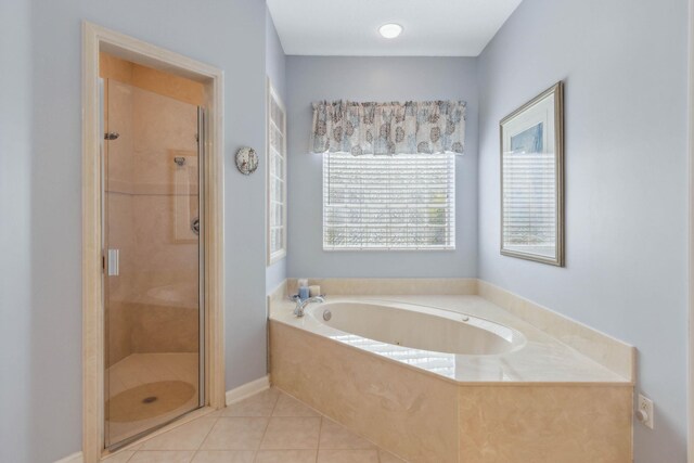 613 Wild Bird Ln, Saint Augustine, FL 32080 - bathroom with a stall shower, a bath, and tile patterned floors