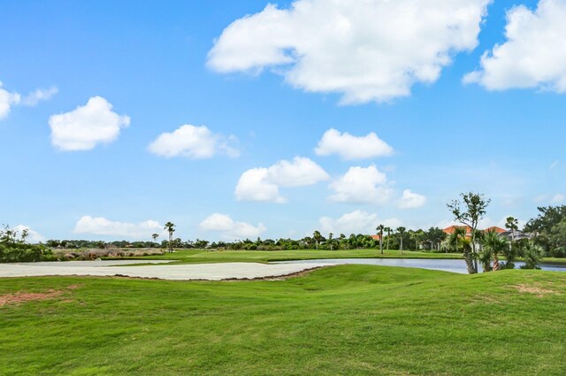 613 Wild Bird Ln, Saint Augustine, FL 32080 - view of home's community with a water view, view of golf course, and a lawn