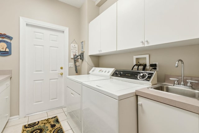 613 Wild Bird Ln, Saint Augustine, FL 32080 - laundry area featuring cabinet space, separate washer and dryer, and light tile patterned floors