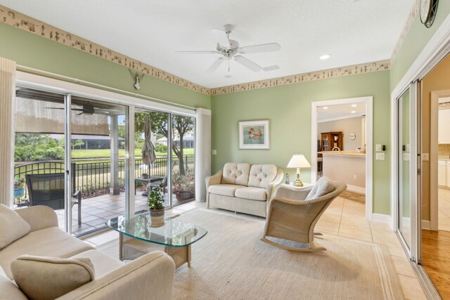 613 Wild Bird Ln, Saint Augustine, FL 32080 - living room with a ceiling fan, a water view, recessed lighting, tile patterned flooring, and baseboards