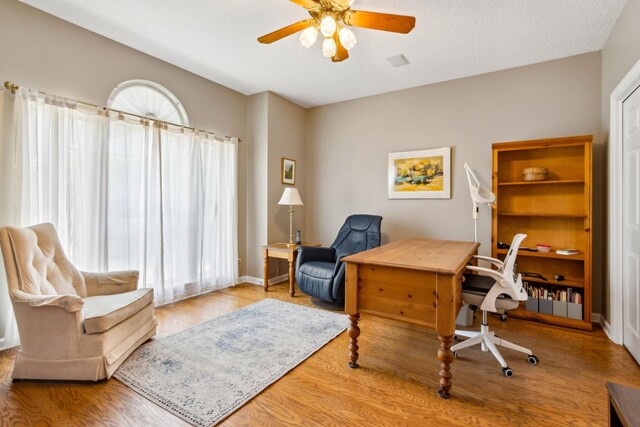 613 Wild Bird Ln, Saint Augustine, FL 32080 - office with ceiling fan, wood finished floors, and baseboards