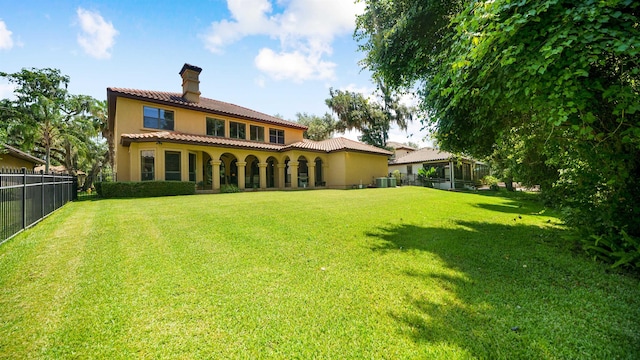 84 Villa Sovana Ct, Saint Johns, FL 32259 - back of house featuring a chimney, a tile roof, and stucco siding