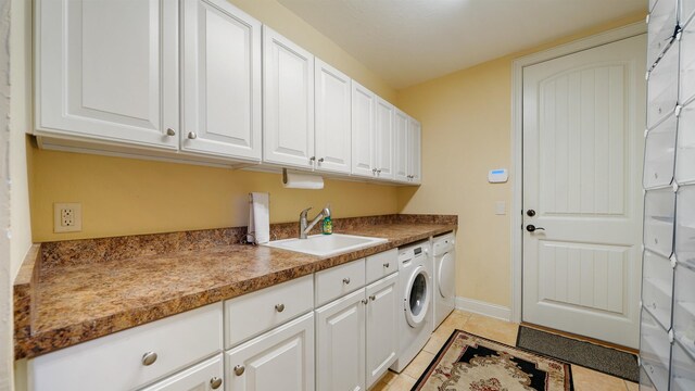 84 Villa Sovana Ct, Saint Johns, FL 32259 - laundry area featuring cabinet space, washing machine and dryer, and light tile patterned flooring
