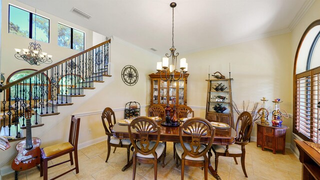 84 Villa Sovana Ct, Saint Johns, FL 32259 - dining space with a chandelier, healthy amount of natural light, light tile patterned flooring, and crown molding