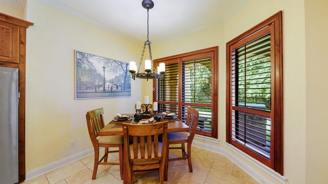 84 Villa Sovana Ct, Saint Johns, FL 32259 - dining space featuring a chandelier, crown molding, and light tile patterned flooring