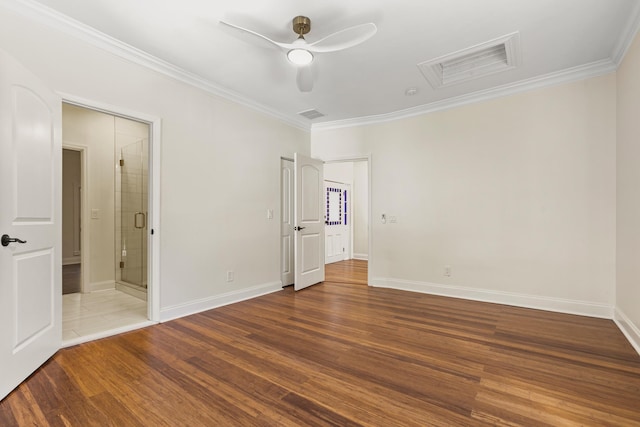 spare room with ceiling fan, hardwood / wood-style floors, and ornamental molding