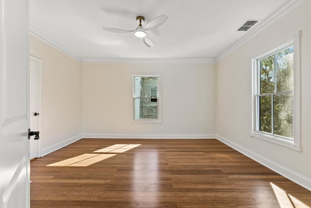 empty room featuring ornamental molding, ceiling fan, and dark wood-type flooring