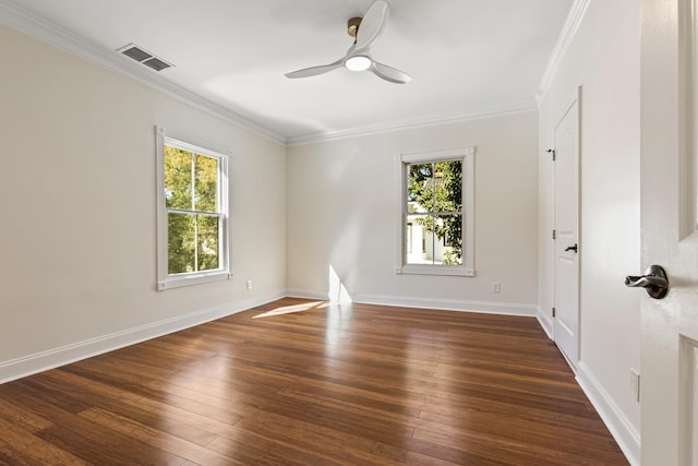 unfurnished room featuring dark hardwood / wood-style floors, a wealth of natural light, crown molding, and ceiling fan