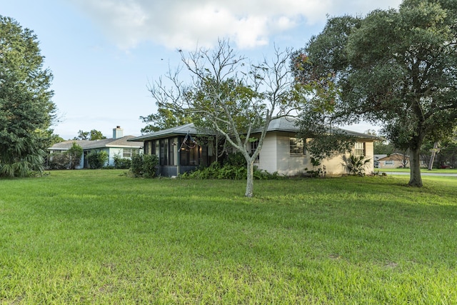 view of yard with a sunroom