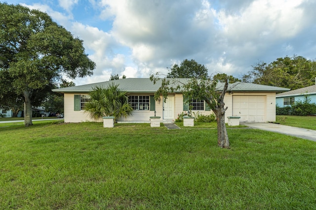 single story home with a garage and a front lawn