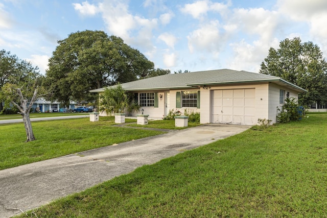 single story home featuring a front lawn and a garage