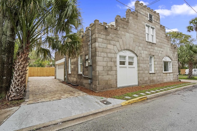 view of property exterior with a garage