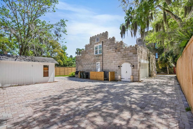 view of side of property with a patio area