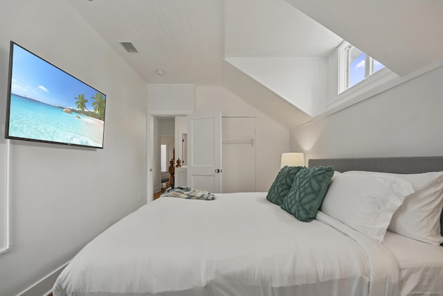 bedroom with lofted ceiling