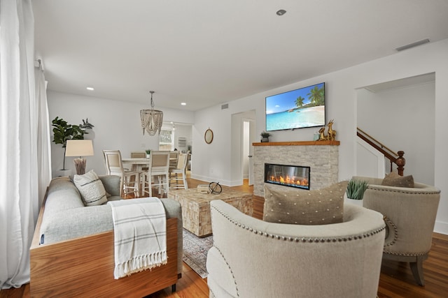 living room with hardwood / wood-style floors and a fireplace