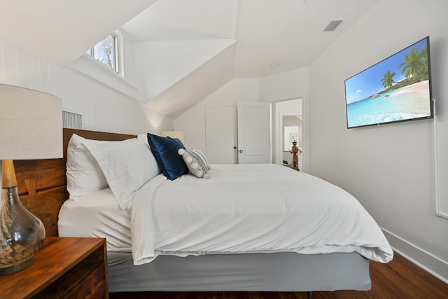 bedroom with hardwood / wood-style flooring