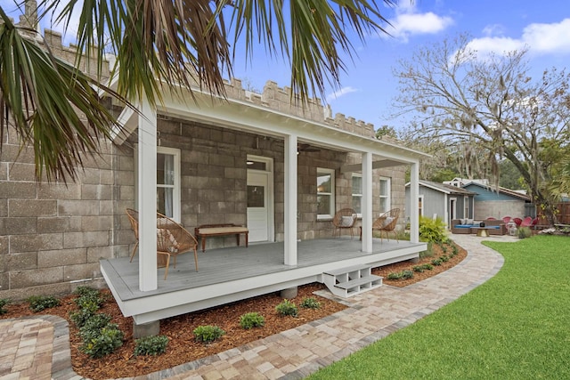 15 Shenandoah St, Saint Augustine, FL 32084 - rear view of house with a yard, fence, an outdoor hangout area, a sunroom, and a deck