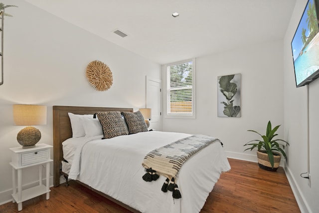 bedroom featuring dark wood-type flooring