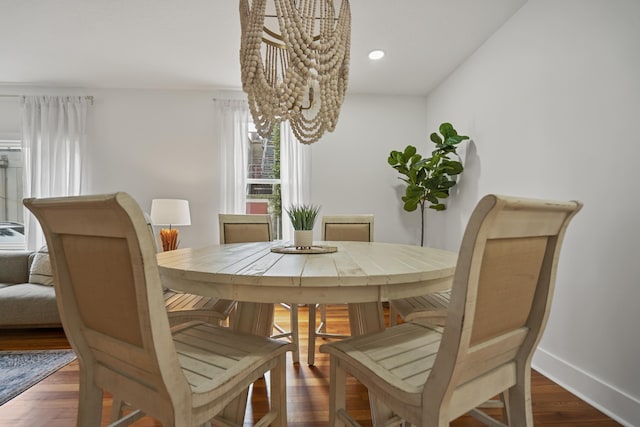 dining area featuring dark wood-type flooring