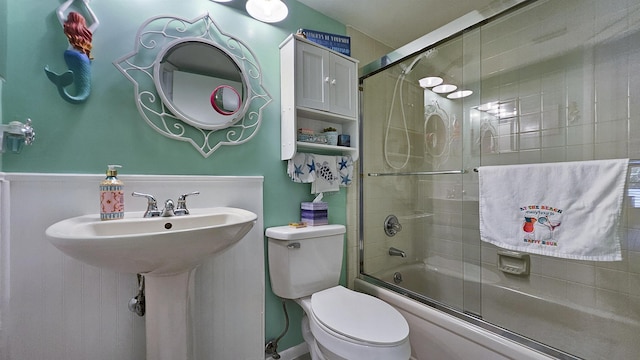 21 Mid Pines Cir Unit 21, Palm Coast, FL 32137 - bathroom with shower / bath combination with glass door and toilet