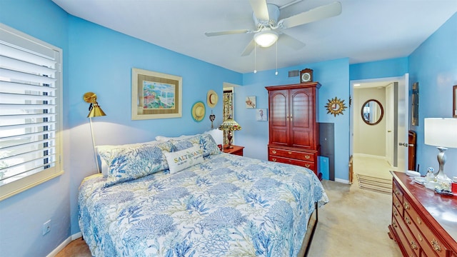 21 Mid Pines Cir Unit 21, Palm Coast, FL 32137 - bedroom with light colored carpet, a ceiling fan, and baseboards