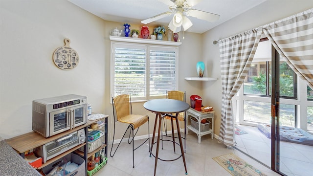 21 Mid Pines Cir Unit 21, Palm Coast, FL 32137 - dining area featuring a ceiling fan, tile patterned flooring, and baseboards