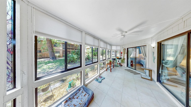 21 Mid Pines Cir Unit 21, Palm Coast, FL 32137 - sunroom / solarium featuring ceiling fan, tile patterned floors, and healthy amount of natural light