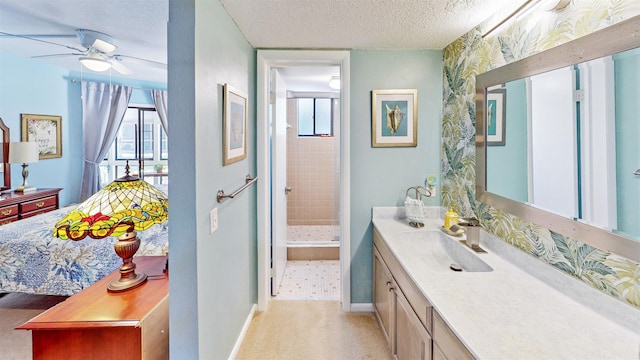 21 Mid Pines Cir Unit 21, Palm Coast, FL 32137 - full bath with vanity, ceiling fan, a textured ceiling, a stall shower, and baseboards