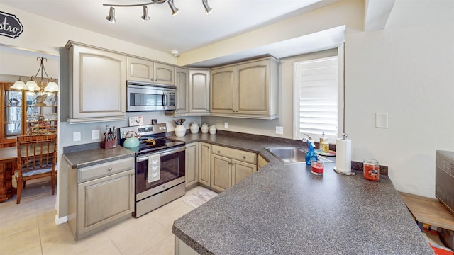21 Mid Pines Cir Unit 21, Palm Coast, FL 32137 - kitchen with stainless steel appliances, dark countertops, a sink, and light tile patterned flooring