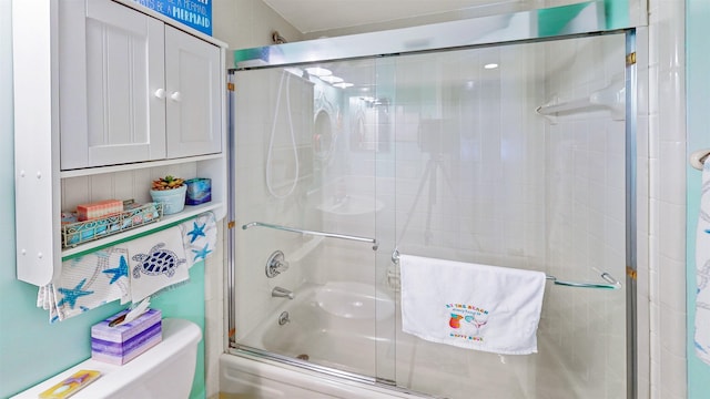 21 Mid Pines Cir Unit 21, Palm Coast, FL 32137 - bathroom featuring shower / bath combination with glass door and toilet