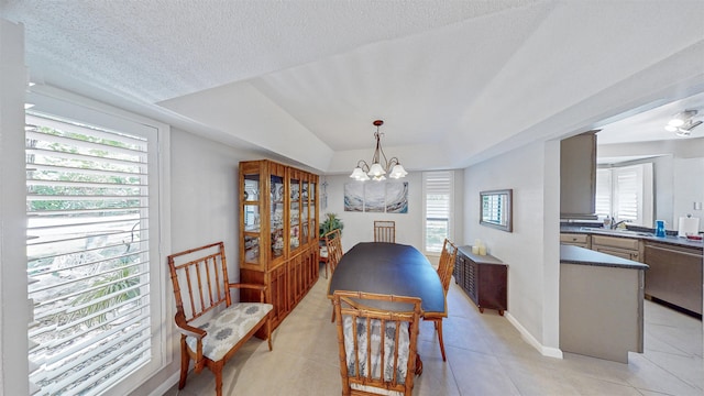 21 Mid Pines Cir Unit 21, Palm Coast, FL 32137 - dining area featuring a chandelier, light tile patterned floors, and baseboards