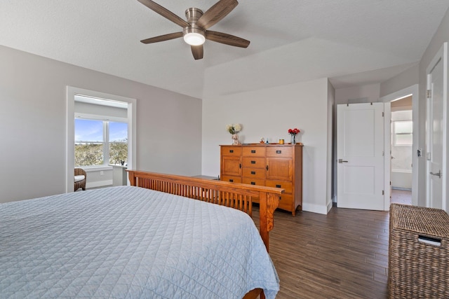 bedroom featuring ceiling fan, baseboards, dark wood finished floors, and a textured ceiling