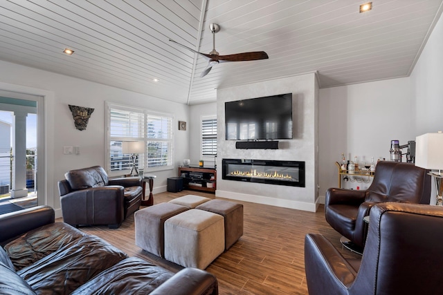 living room with baseboards, a ceiling fan, wooden ceiling, wood finished floors, and a fireplace