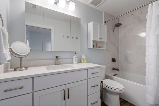 full bathroom featuring a textured ceiling, toilet, vanity, visible vents, and shower / bath combo