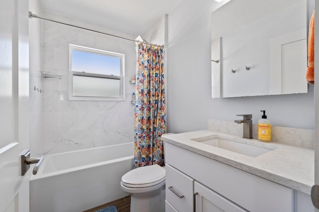 bathroom featuring vanity, toilet, and shower / bath combo with shower curtain