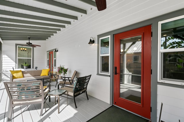 exterior space featuring an outdoor hangout area, a porch, and a ceiling fan