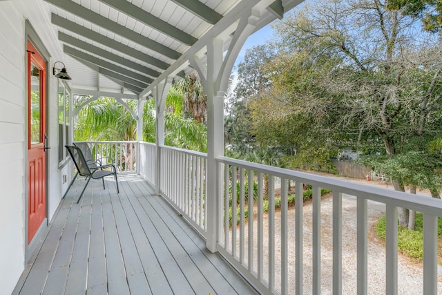 wooden terrace with a porch