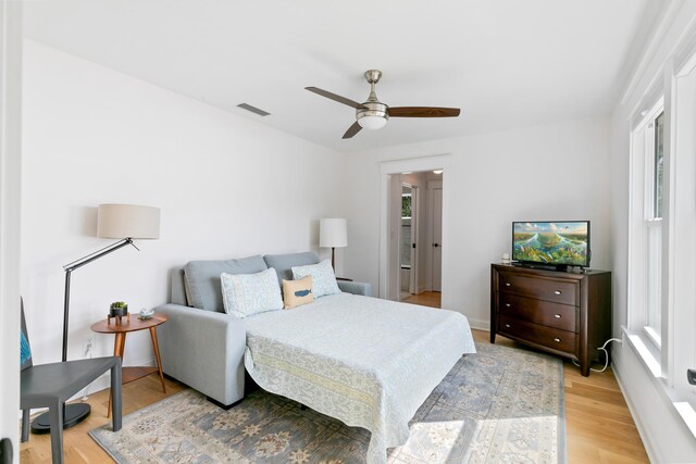 stairway featuring recessed lighting, baseboards, an inviting chandelier, and wood finished floors