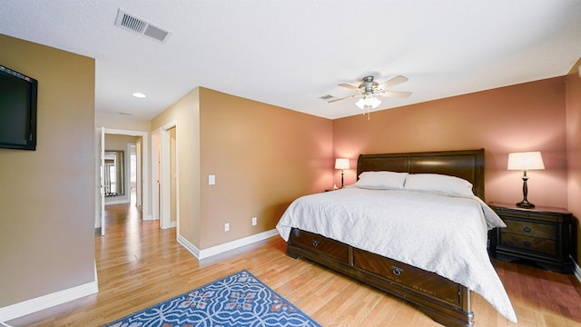 bedroom with ceiling fan and light wood-type flooring