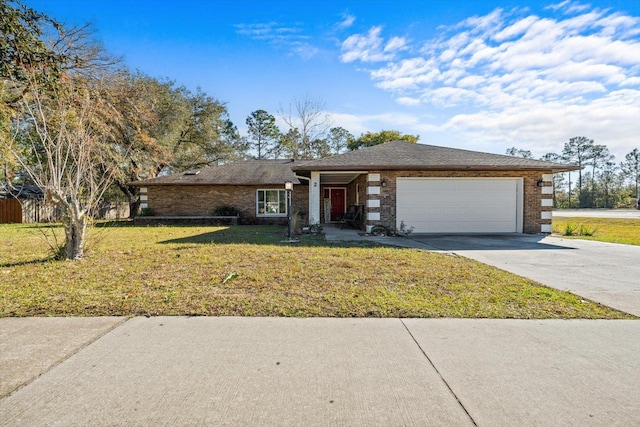 ranch-style home with a garage and a front lawn