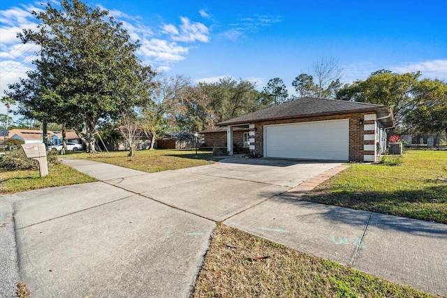 ranch-style house with a front lawn, a garage, and central AC