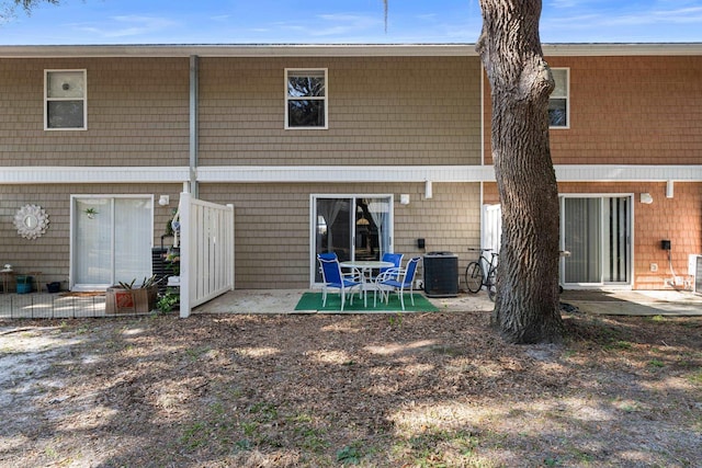 back of property with a patio and central air condition unit